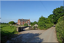 SJ7725 : Peggs Lane and house near High Offley, Staffordshire by Roger  D Kidd