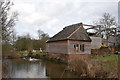 Pond and building at Hull Green