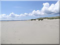 SH5436 : The beach at Morfa Bychan by Eirian Evans