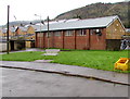 Yellow grit box and metal bench, Cwmsaerbren Street, Treherbert