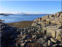 NG7527 : Stony beach on the Plock of Kyle by Julian Paren