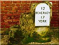 Old Milestone formerly by the A1079, Manor Farm barn, Shipton Thorpe parish