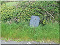 Old slate milestone on A497