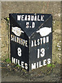 Milepost on the A689 at the west end of St. John