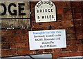 Old Milestone plate displayed in Hall Square, Boroughbridge