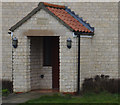 Porch with datestone