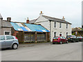 Old garages and former pub, Talkin village