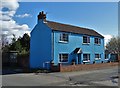 Blue house under a blue sky