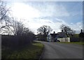 A pair of semi-detached houses by the road near Betton Strange