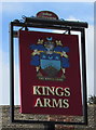 Kings Arms name sign on a High Street post in Prestbury