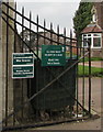 Notices on a cemetery entrance gate, Newport