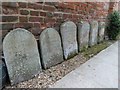 Headstones by the wall