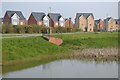 Pond and houses at Abbotswood