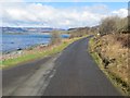 NR7371 : Road (B8024) beside Loch Caolisport near to Creag nam Fitheach by Peter Wood