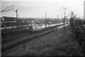 Class 52, D1070 Western Gauntlet at Exmouth Junction coal depot, with Exmouth to Exeter train passing on the main line