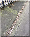 Cast-iron cover to a surface water channel, Fore Street, Teignmouth