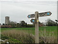 Footpath sign and church at Cawston