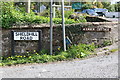 Shieldhill Road and Cruck Cottage Signs