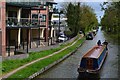 Narrowboat approaching Tramway Road bridge