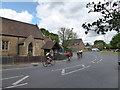 Cyclists passing St Peter, West Molesey
