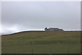 Building across the fields on the Hamnavoe Road