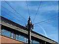 Telephone pole with finial