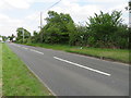 The B5126 Mold Road and a damaged milestone