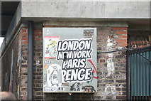 TQ3570 : View of a "London New York Paris Penge" sticker below the railway bridge on Penge Lane by Robert Lamb