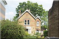 View of a house tucked away between Ridgeway Court and houses on Wordsworth Road