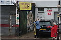 View of tiger street art on the side wall of SR Motors on Maple Road