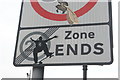 View of a skateboard sticker on a road sign at the end of Maple Road