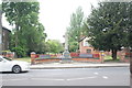 View of the war memorial by the entrance to Penge Recreation Ground from Penge High Street