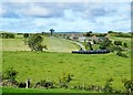 Derelict farmhouse and outbuildings and new zinc sheds on the Ummerinvore Road