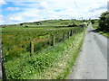 Tullyneill Road crossing partially reclaimed wetland by Tullyvallen Reform Presbyterian Church