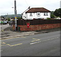 Red postbox in a wall on a corner in the north of Caerphilly