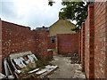 Roofless building, former builder