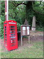 Phone box, notice board and monument