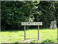 TG2306 : Harwood Road sign by Geographer