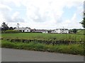 Traditional farmhouses and a modern bungalow West of the Skerriff Road