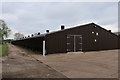 Footpath past poultry sheds