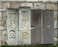 Graveslabs on Tarves Church wall