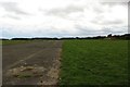 NU2025 : Road at Brunton Airfield by Graham Robson