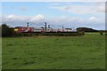 NU1925 : Grass field beside the East Coast Mainline by Graham Robson