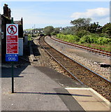 ST1166 : Welsh/English notice at the western end of Barry Island railway station by Jaggery