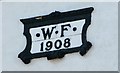 Plaque with the initials W.F. and the year 1908