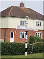 Signpost at the junction of The Green and Palmer