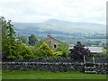 SD6078 : View of High Biggins farm, with Ingleborough in the distance by Alex Passmore