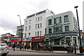 TQ2583 : Shops on Kilburn High Road by David Howard
