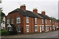 Row of houses on southwest side of A52