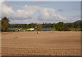 NH5041 : Harvested field, by Broomhill by Craig Wallace